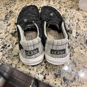 Men’s size 11. HeyDude slide sneakers black and white